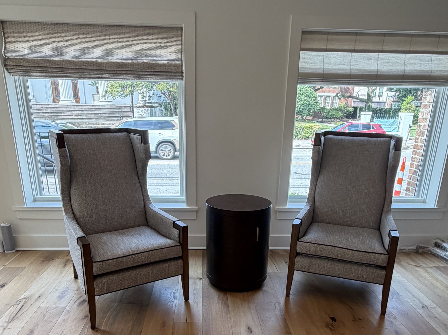 Seating at the windows, dressed with woven wood shades